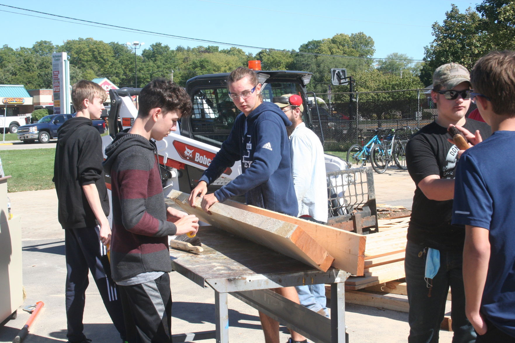 Students prepare wood
